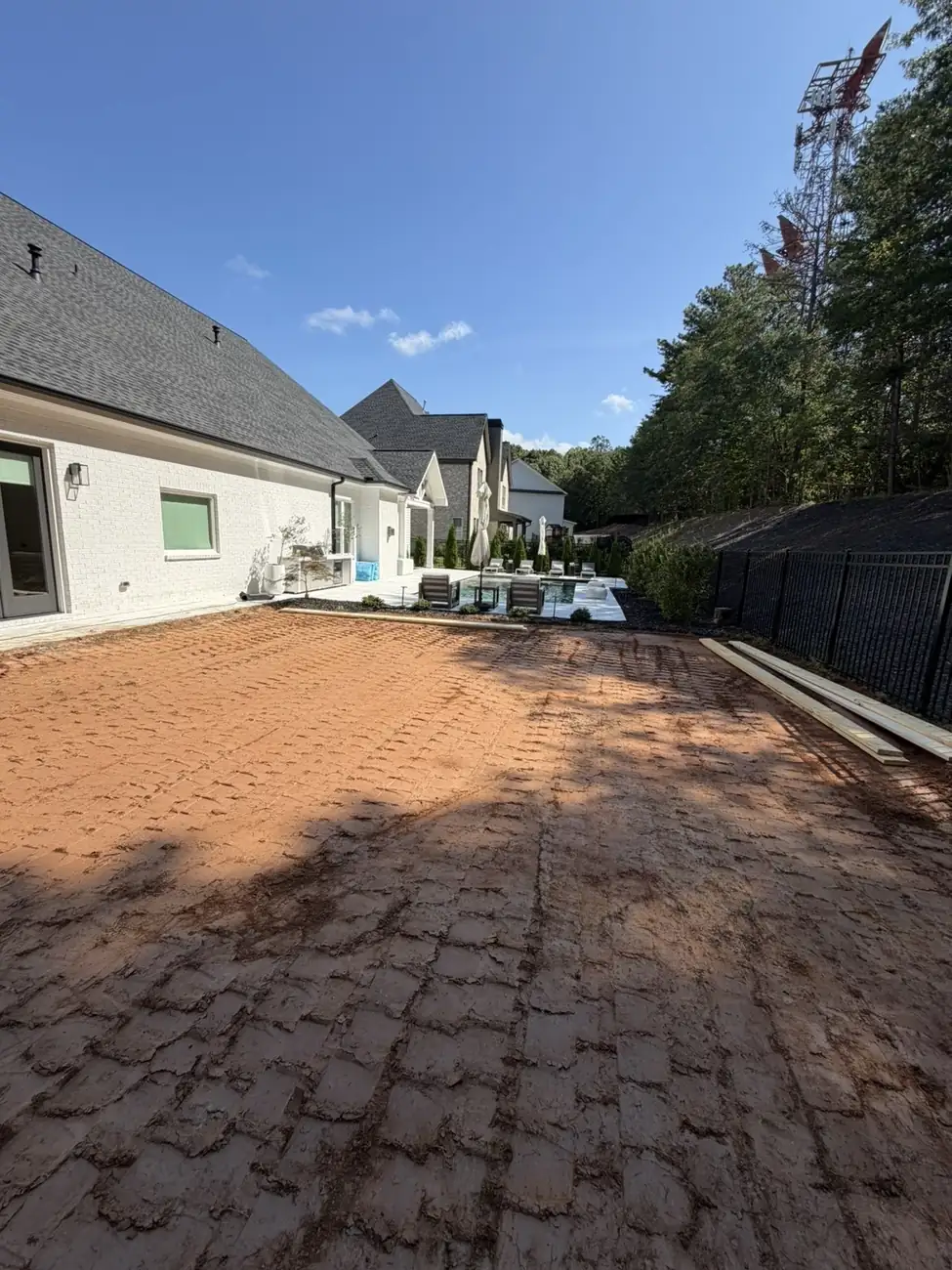 Same backyard after sod removal and grading, ready for the next phase